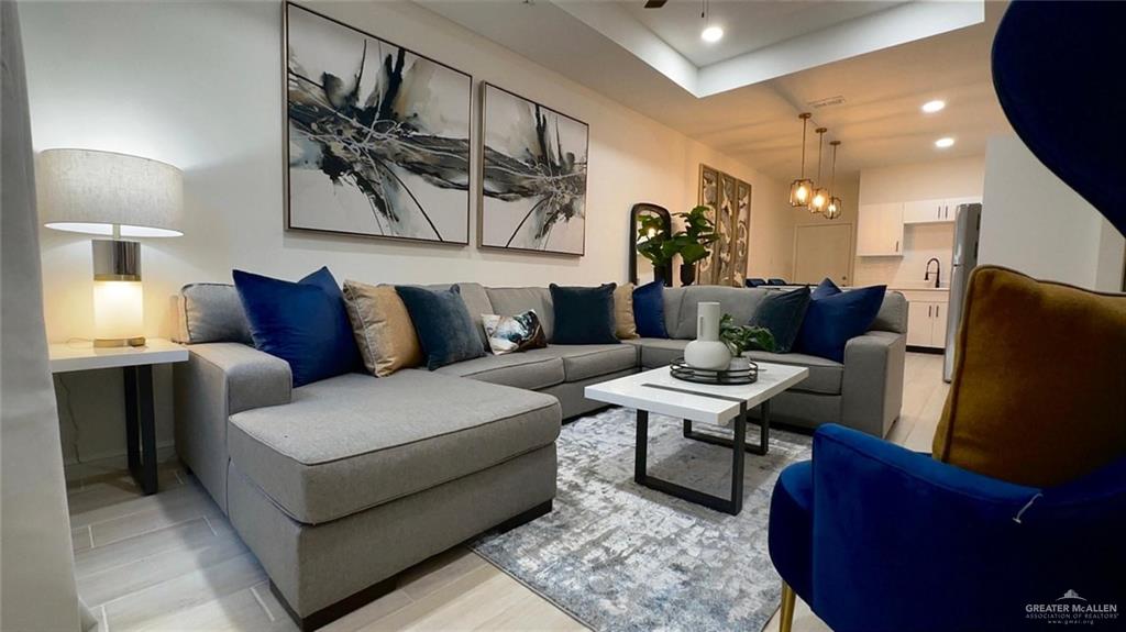 5321 Vision Street Rio Grande City, TX 78582 - Photo 33 of 34 a living room with furniture and a lamp