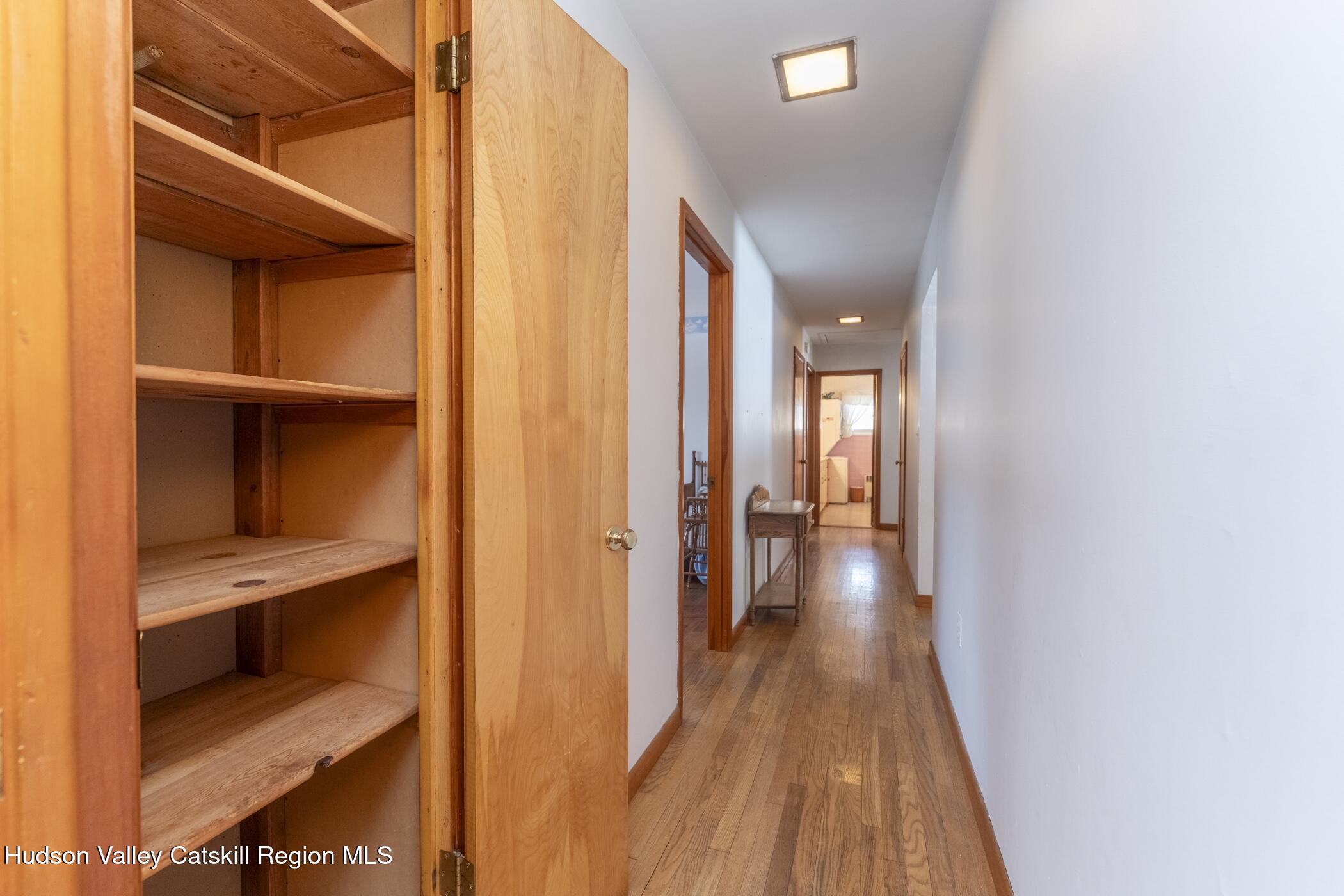 232 Cedar Hill Road High Falls, NY 12440 - Photo 23 of 42 a view of a hallway with wooden floor and a bathroom