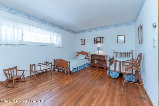 a spacious bathroom with a sink a mirror and a toilet