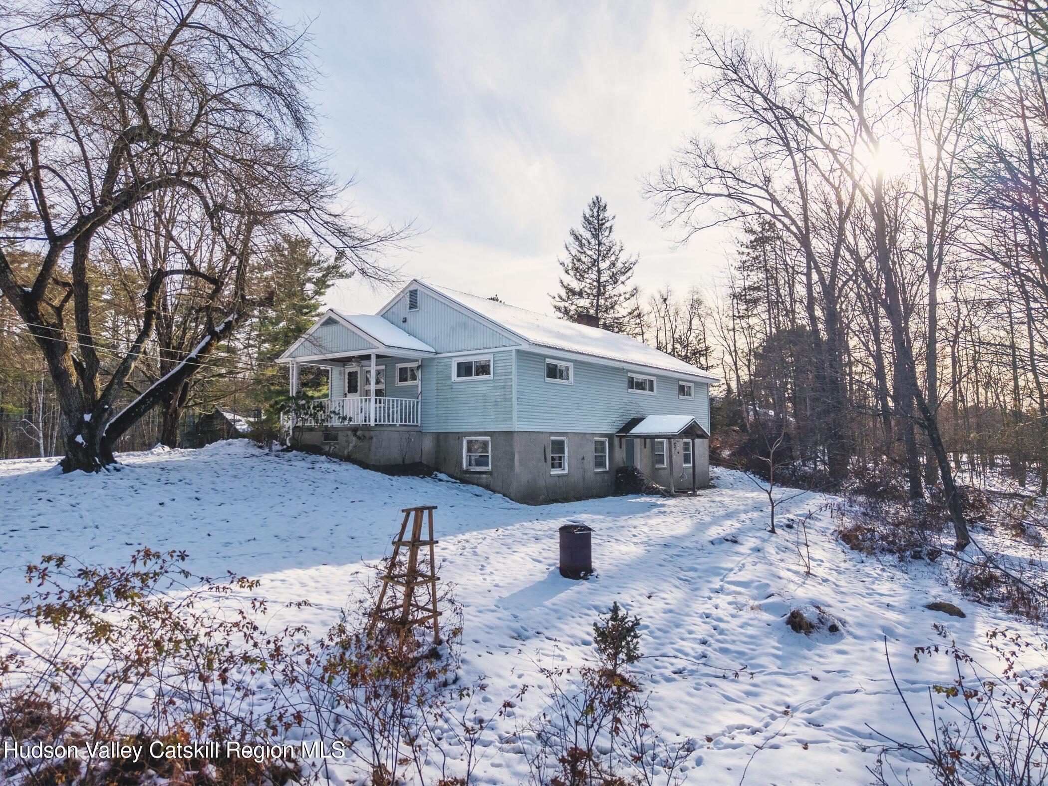 232 Cedar Hill Road High Falls, NY 12440 - Photo 42 of 42 a front view of a house with a yard covered in snow