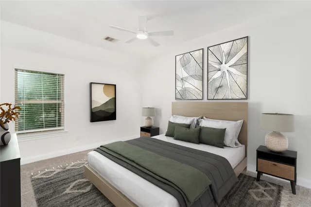 a bedroom with a bed and a window