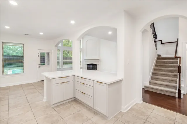 an entryway with an empty room