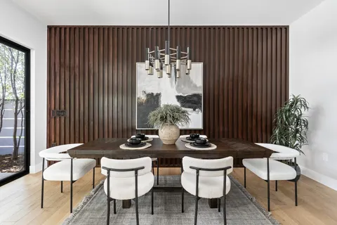 a dining room with furniture and chandelier