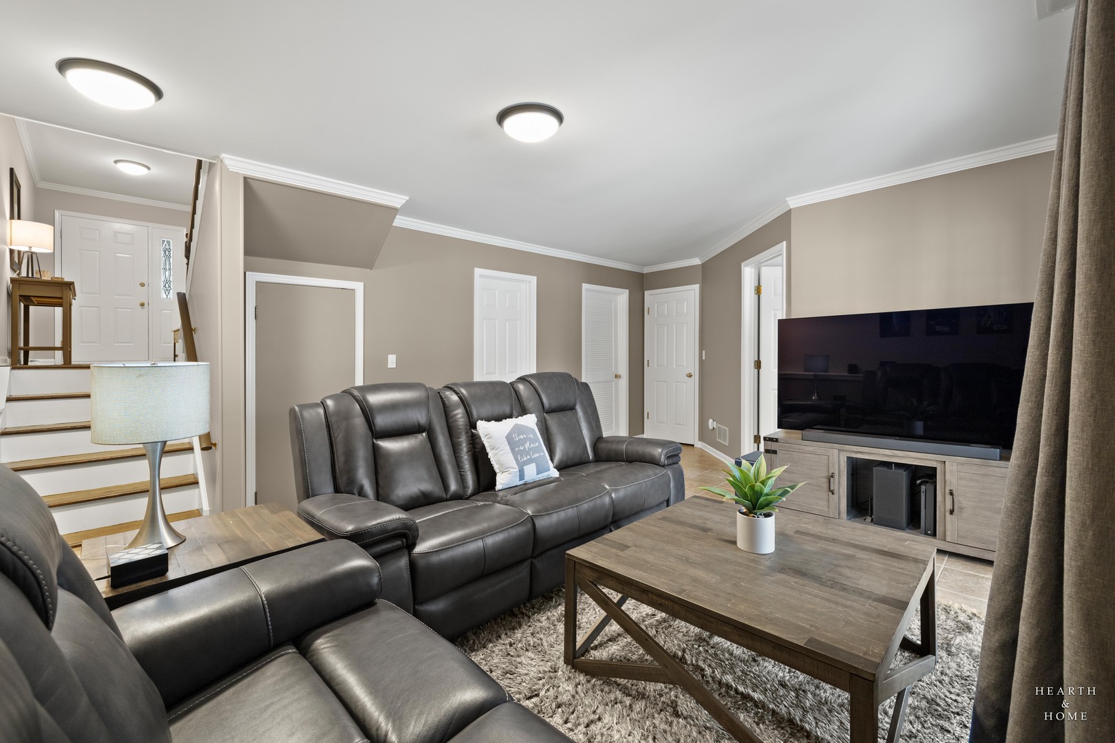 679 Barlina Road Crystal Lake, IL 60014 - Photo 22 of 28 a living room with furniture and a flat screen tv