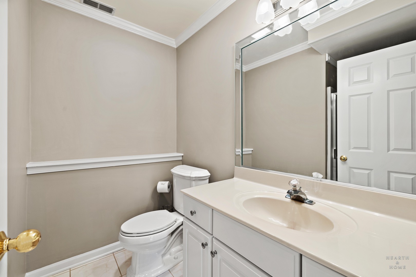 679 Barlina Road Crystal Lake, IL 60014 - Photo 24 of 28 a bathroom with a sink toilet and vanity