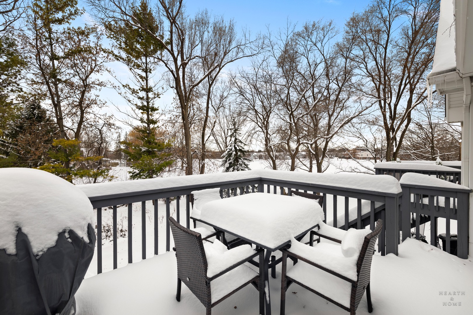 679 Barlina Road Crystal Lake, IL 60014 - Photo 26 of 28 a view of a patio with a table chairs and wooden fence