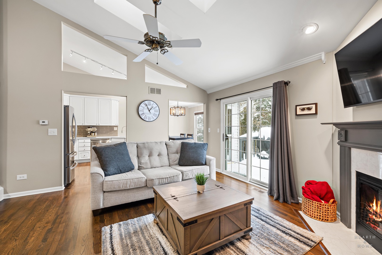 679 Barlina Road Crystal Lake, IL 60014 - Photo 4 of 28 a living room with furniture a flat screen tv and a window