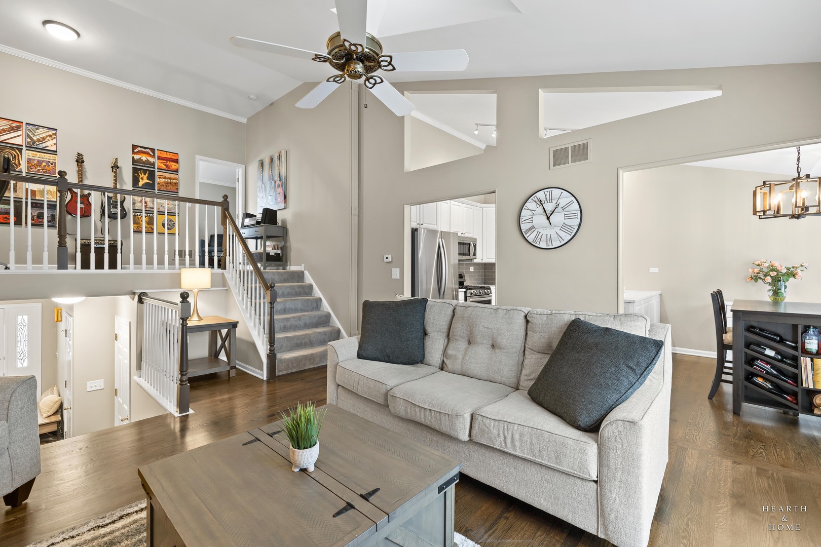 679 Barlina Road Crystal Lake, IL 60014 - Photo 5 of 28 a living room with furniture a clock and a bookshelf