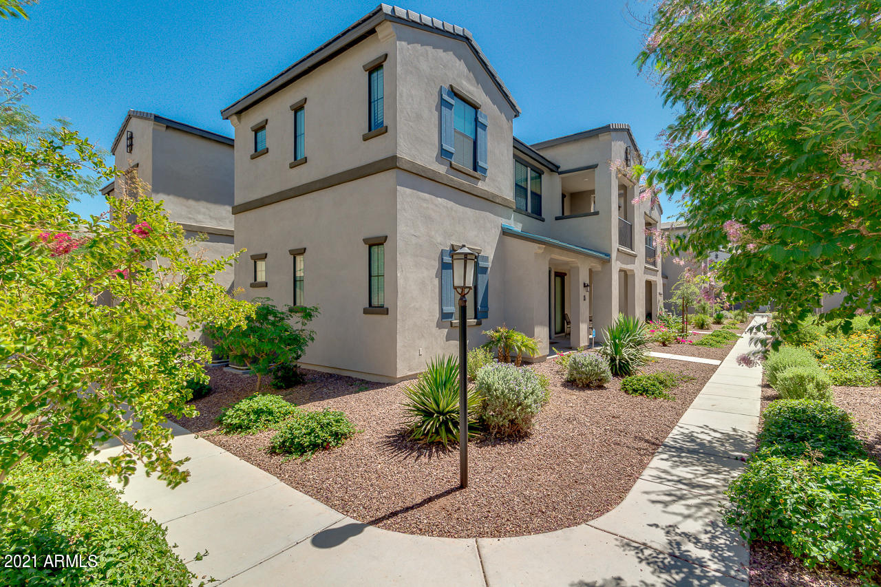 3900 East Baseline Road, Unit 135 Phoenix, AZ 85042 - Photo 1 of 19 a front view of a house with garden