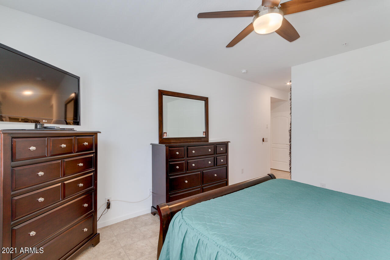 3900 East Baseline Road, Unit 135 Phoenix, AZ 85042 - Photo 12 of 19 a bedroom with a bed and a dresser