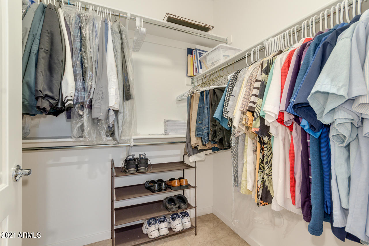 3900 East Baseline Road, Unit 135 Phoenix, AZ 85042 - Photo 14 of 19 a view of walk in closet with clothes and shoes