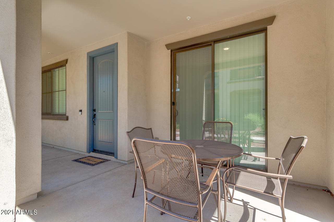 3900 East Baseline Road, Unit 135 Phoenix, AZ 85042 - Photo 3 of 19 a view of a dining room with furniture and a mirror