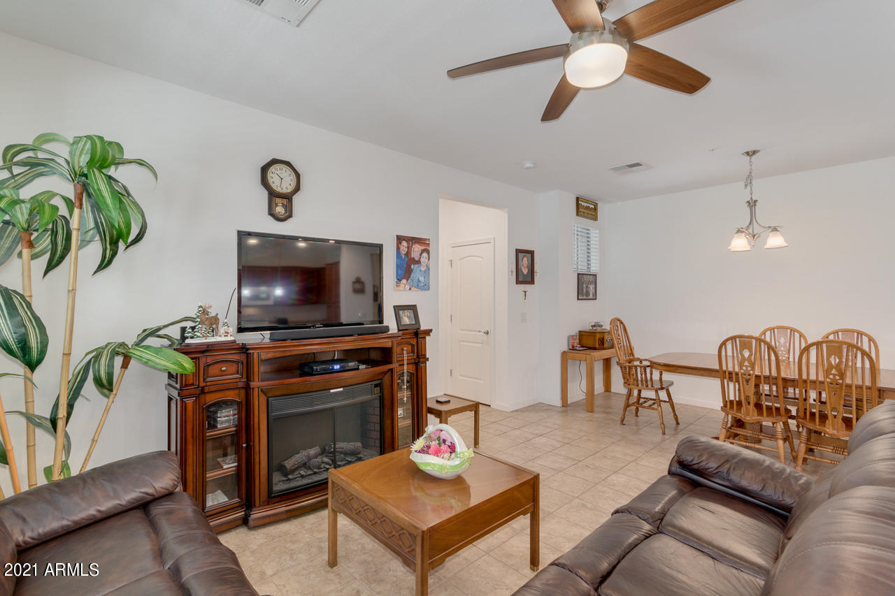 3900 East Baseline Road, Unit 135 Phoenix, AZ 85042 - Photo 4 of 19 a living room with furniture and a flat screen tv