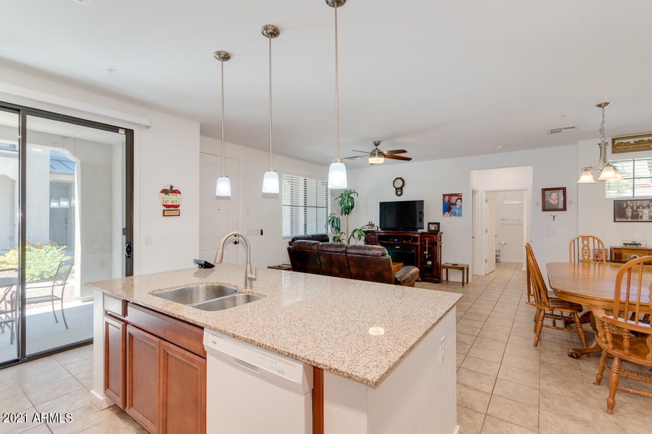 3900 East Baseline Road, Unit 135 Phoenix, AZ 85042 - Photo 8 of 19 a kitchen with a sink a counter space and a view of living room