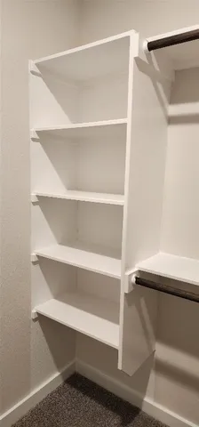 a close up view of walk in closet