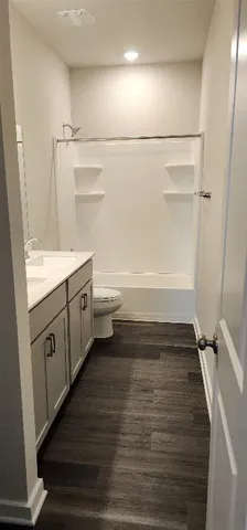 a bathroom with a vanity and a bathtub