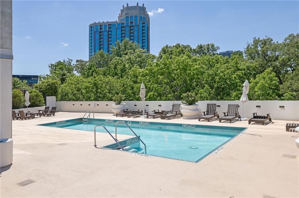 2828 Peachtree Road Northwest, Unit 1901 Atlanta, GA 30305 - Photo 35 of 35 a view of a swimming pool with a patio