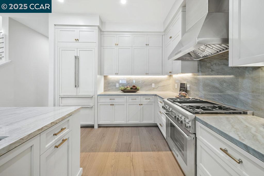 600 Hartz Avenue, Unit 103 Danville, CA 94526 - Photo 12 of 34 a kitchen with white cabinets and appliances