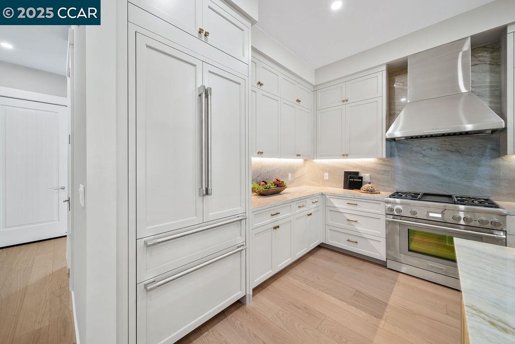 600 Hartz Avenue, Unit 103 Danville, CA 94526 - Photo 14 of 34 a kitchen with white cabinets and white appliances