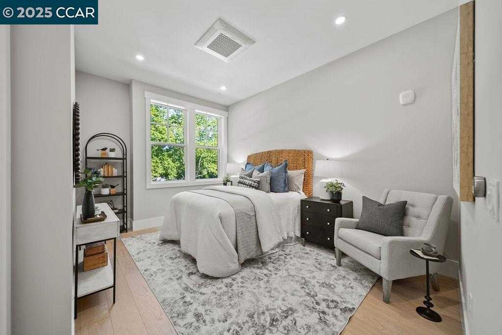 600 Hartz Avenue, Unit 103 Danville, CA 94526 - Photo 18 of 34 a bedroom with a bed and a couch