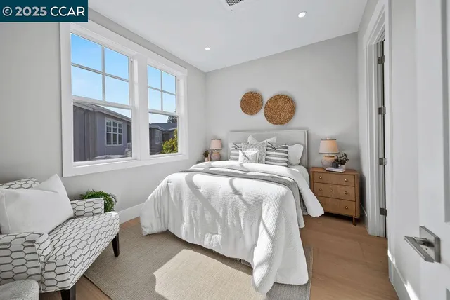 a bedroom with a bed and window