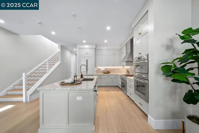 a kitchen with sink and stove