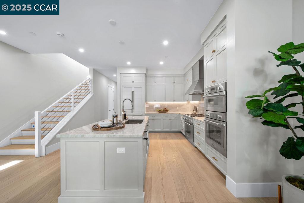 600 Hartz Avenue, Unit 103 Danville, CA 94526 - Photo 27 of 34 a kitchen with sink and stove