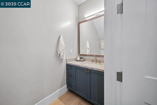 a bathroom with a sink and mirror