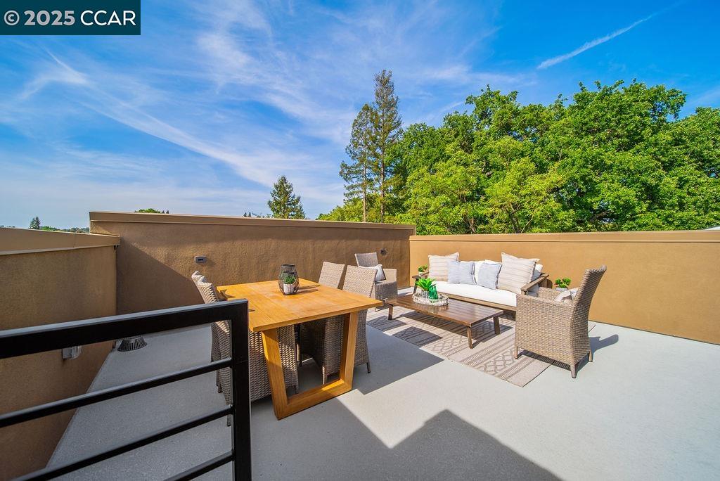 600 Hartz Avenue, Unit 103 Danville, CA 94526 - Photo 32 of 34 a balcony with table and chairs