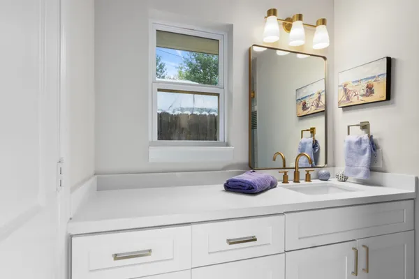 a bathroom with a sink and a mirror