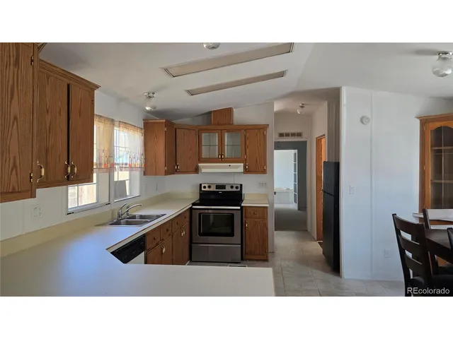 a kitchen with a table and chairs