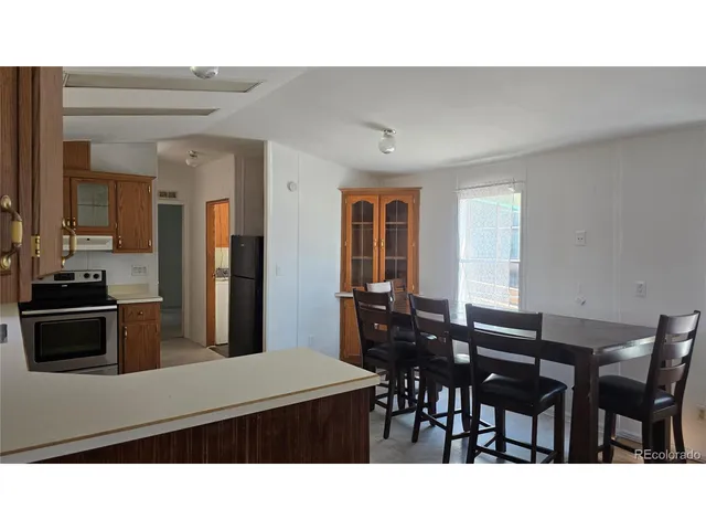 a kitchen with a table and chairs in it
