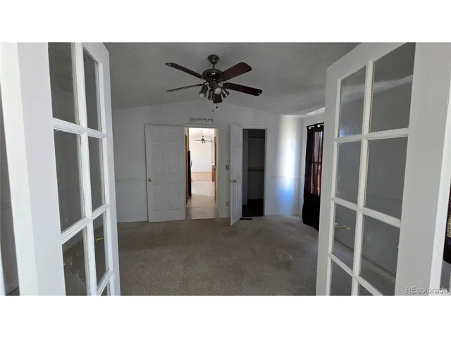 a kitchen with a table and chairs in it