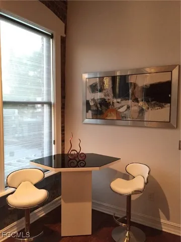 a kitchen with a table and chairs in it