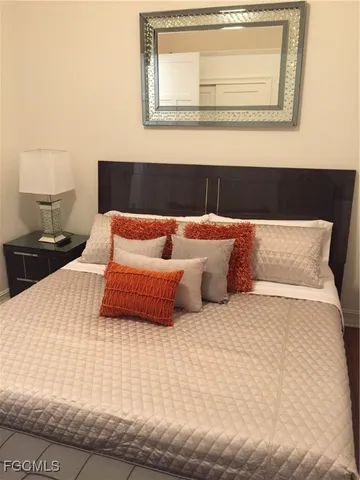 a view of water heater room with wooden floor