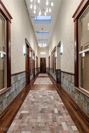 a view of gallery with wooden floor