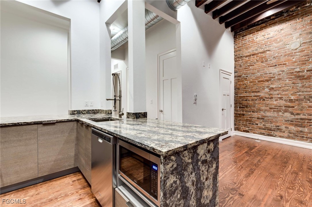 2278 First Street, Unit 204 Fort Myers, FL 33901 - Photo 7 of 24 a view of a kitchen from the hallway