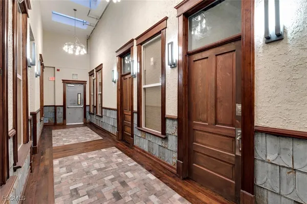 a bathroom with a double vanity sink toilet and shower