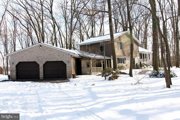 21601 Gunpowder Road Manchester, MD 21102 - Photo 2 of 30 a view of a house with a snow in front of it