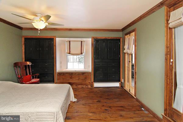 21601 Gunpowder Road Manchester, MD 21102 - Photo 19 of 30 a bed room with a bed mirror and a window