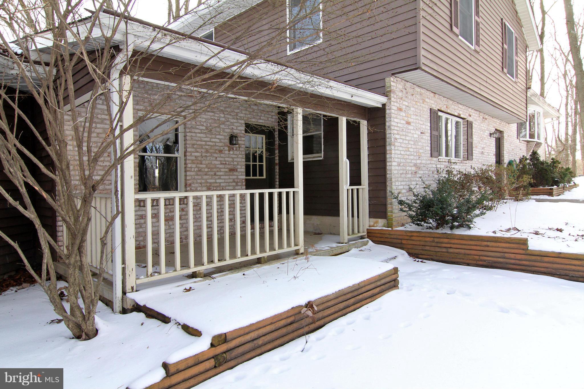 21601 Gunpowder Road Manchester, MD 21102 - Photo 30 of 30 a view of a porch with a bench