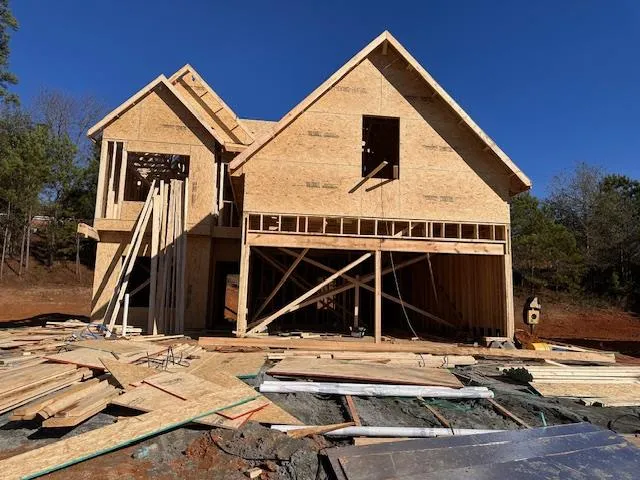 a view of a house with wooden deck