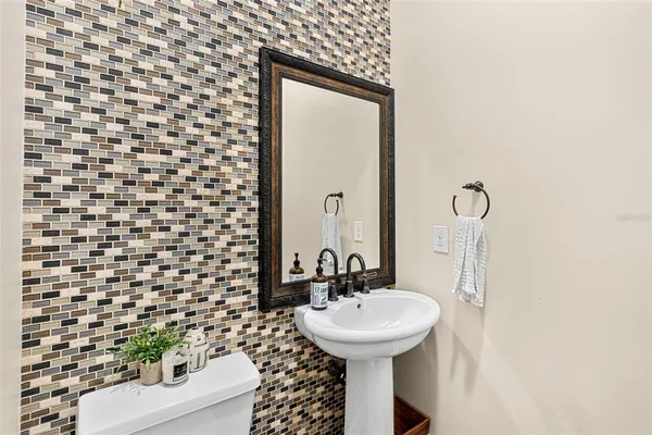 a bathroom with a sink and mirror