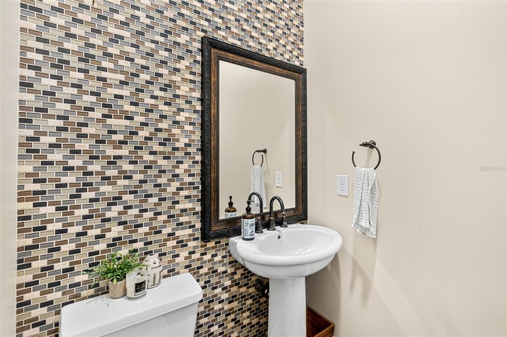 1674 Victoria Way Winter Garden, FL 34787 - Photo 25 of 42 a bathroom with a sink and mirror