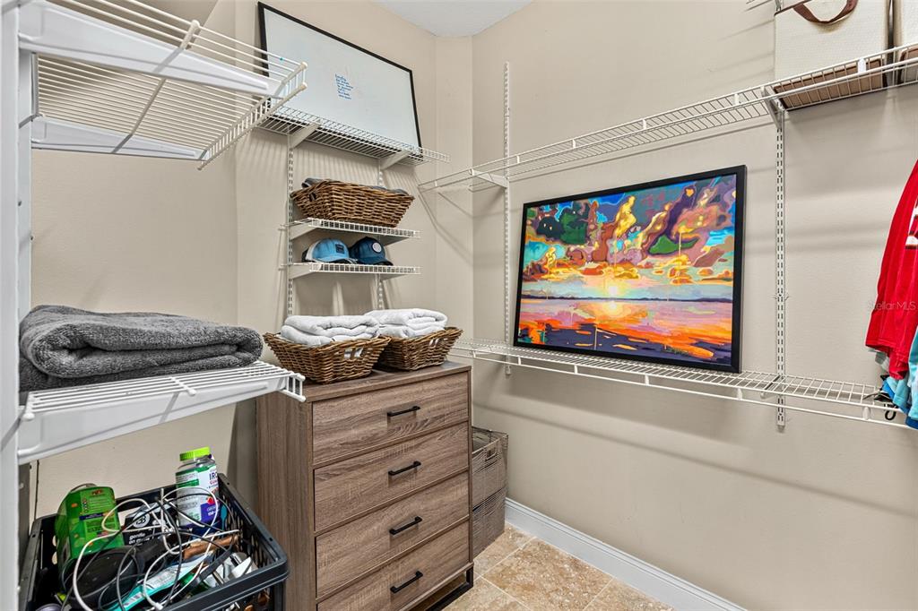 1674 Victoria Way Winter Garden, FL 34787 - Photo 34 of 42 a kitchen with stainless steel appliances granite countertop a stove and a painting on the wall