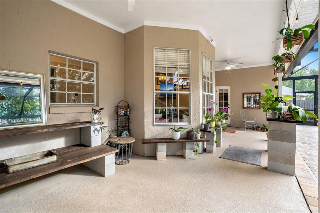 1674 Victoria Way Winter Garden, FL 34787 - Photo 36 of 42 a living room filled with furniture gym equipment and a large window