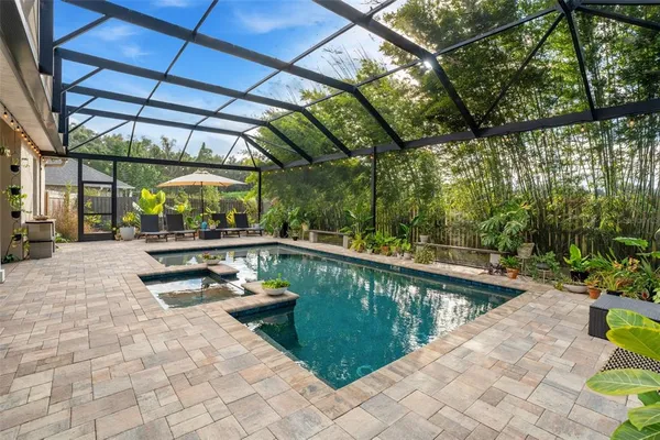 a view of a swimming pool with a patio