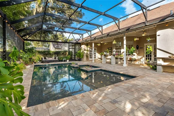 a view of a swimming pool with a patio