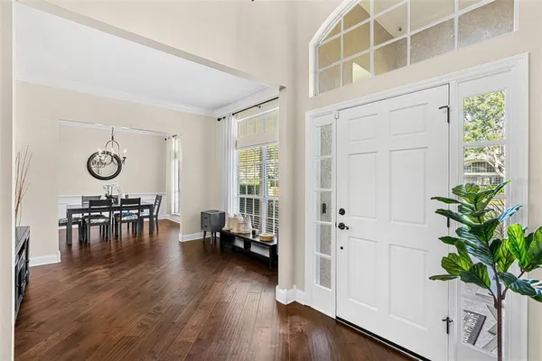 a view of dining room with furniture and wooden floor