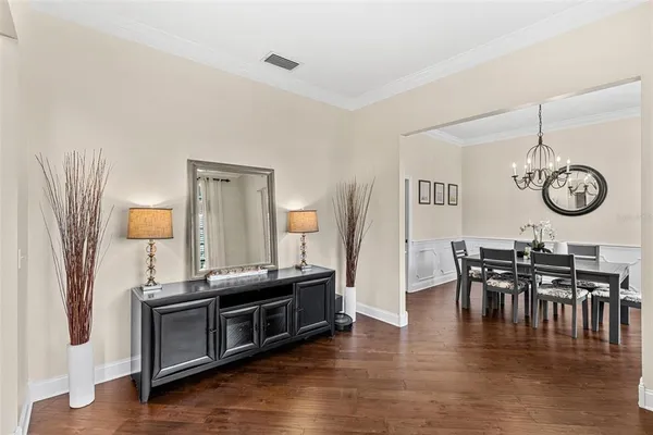 a view of kitchen with furniture and wooden floor